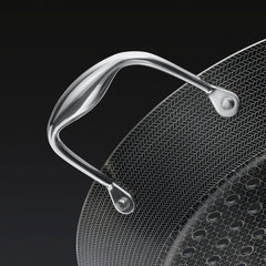 A close up of the handle of the HexClad 12&quot Hybrid BBQ Grill Pan
