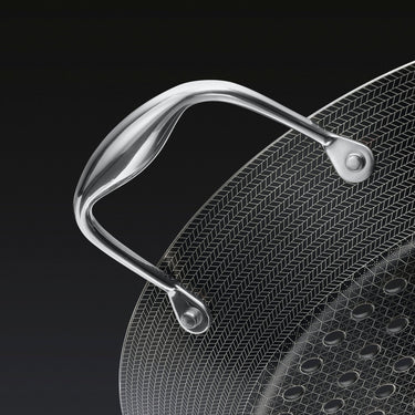 A close up of the handle of the HexClad 12&quot Hybrid BBQ Grill Pan
